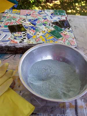 Mix grout in a stainless steel bowl (easier to clean)