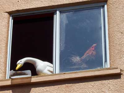 The goose ornament and it's rooster buddy