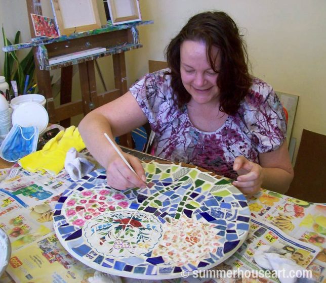 Student Jane, cleaning grout on her mosaic, summerhouseart.com