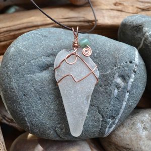 Frosty white sea glass with copper wire wrapping and a green glass bead. Will Bushell, FoundMadeArt, Etsy.