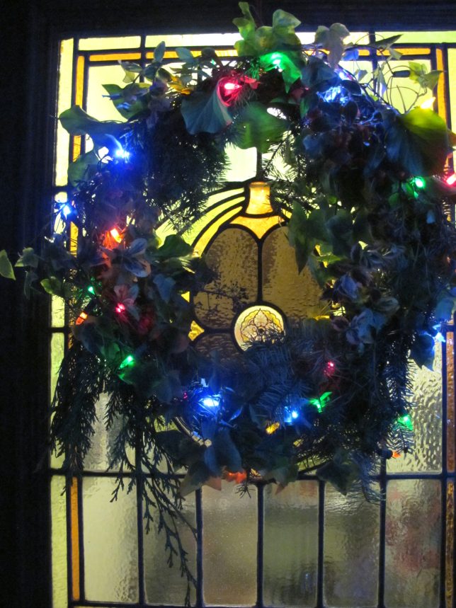 Wreath on a Stained glass door at night, summerhouseart.com